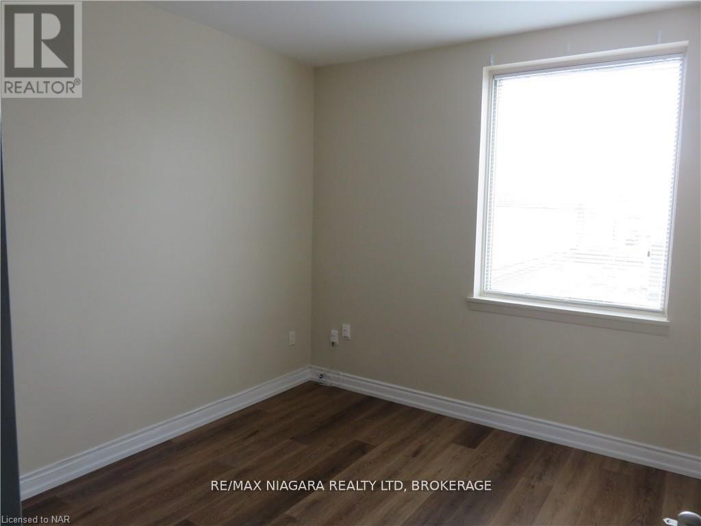 203 - 58 Jarvis Street, Fort Erie (Central), Ontario  L2A 2S4 - Photo 5 - X12452566